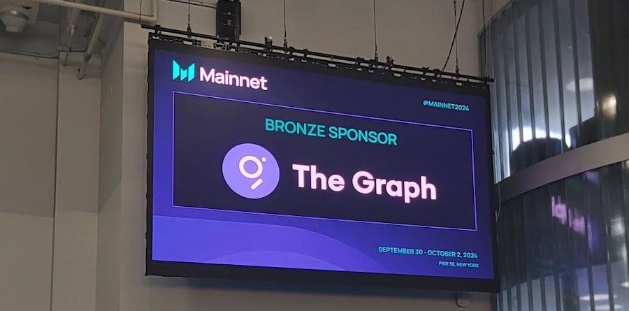 A giant digital screen showing "Bronze Sponsor The Graph"